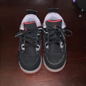 Black and grey Jordan retro 4